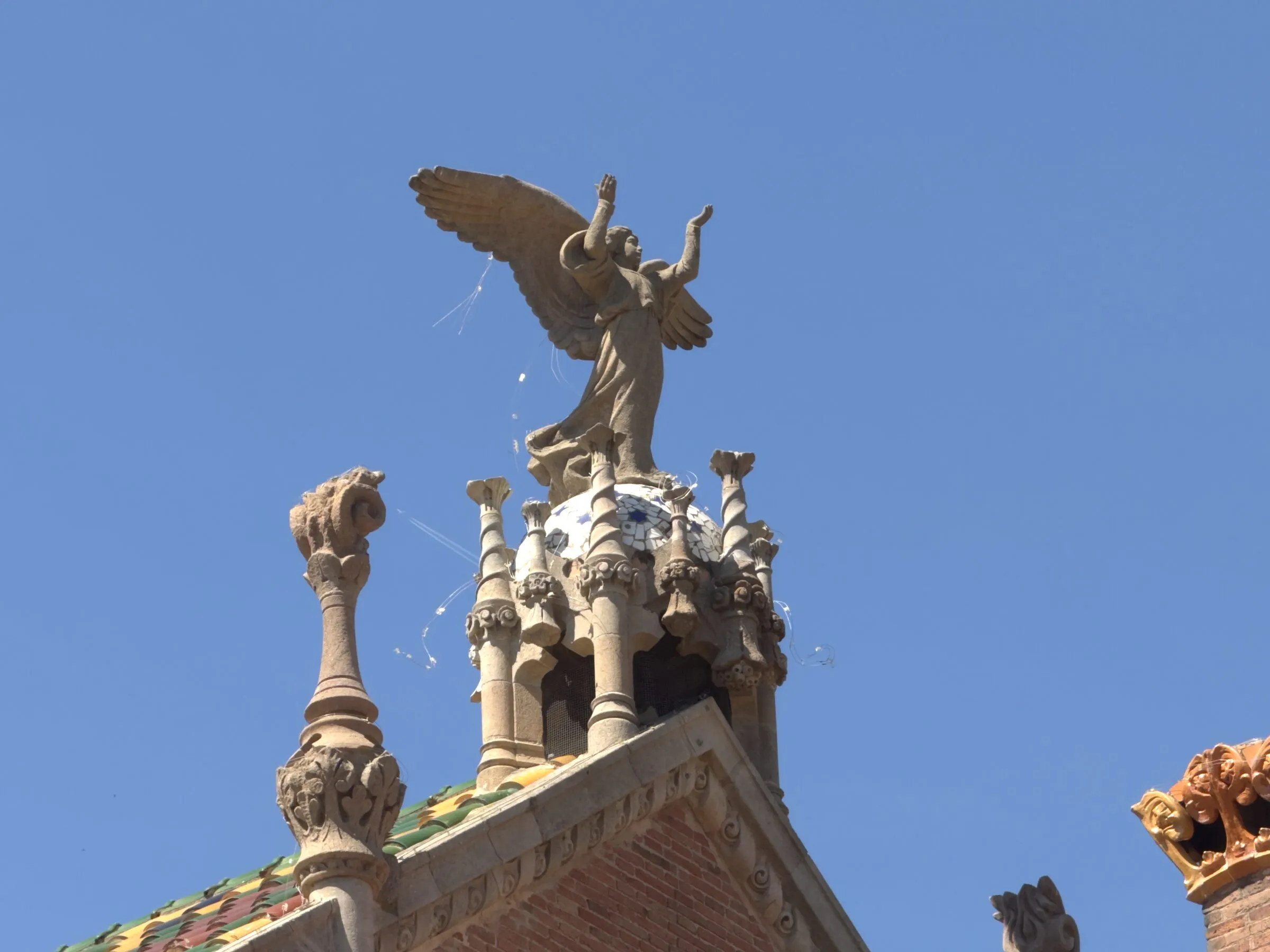 A mosaic tower and gold dome at the Hospital de Sant Pau, Barcelona