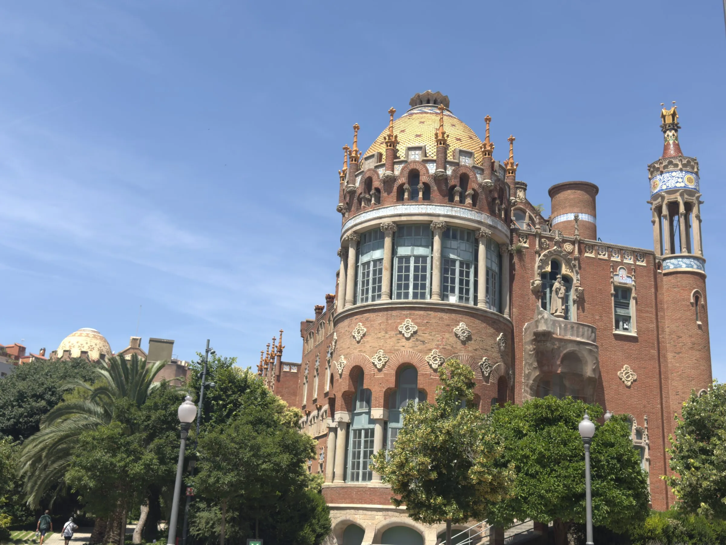 A mosaic tower and gold dome at the Hospital de Sant Pau, Barcelona