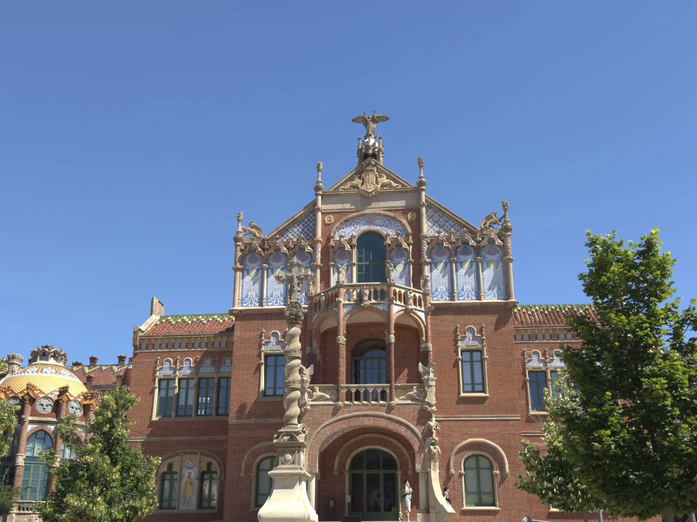 A mosaic tower and gold dome at the Hospital de Sant Pau, Barcelona