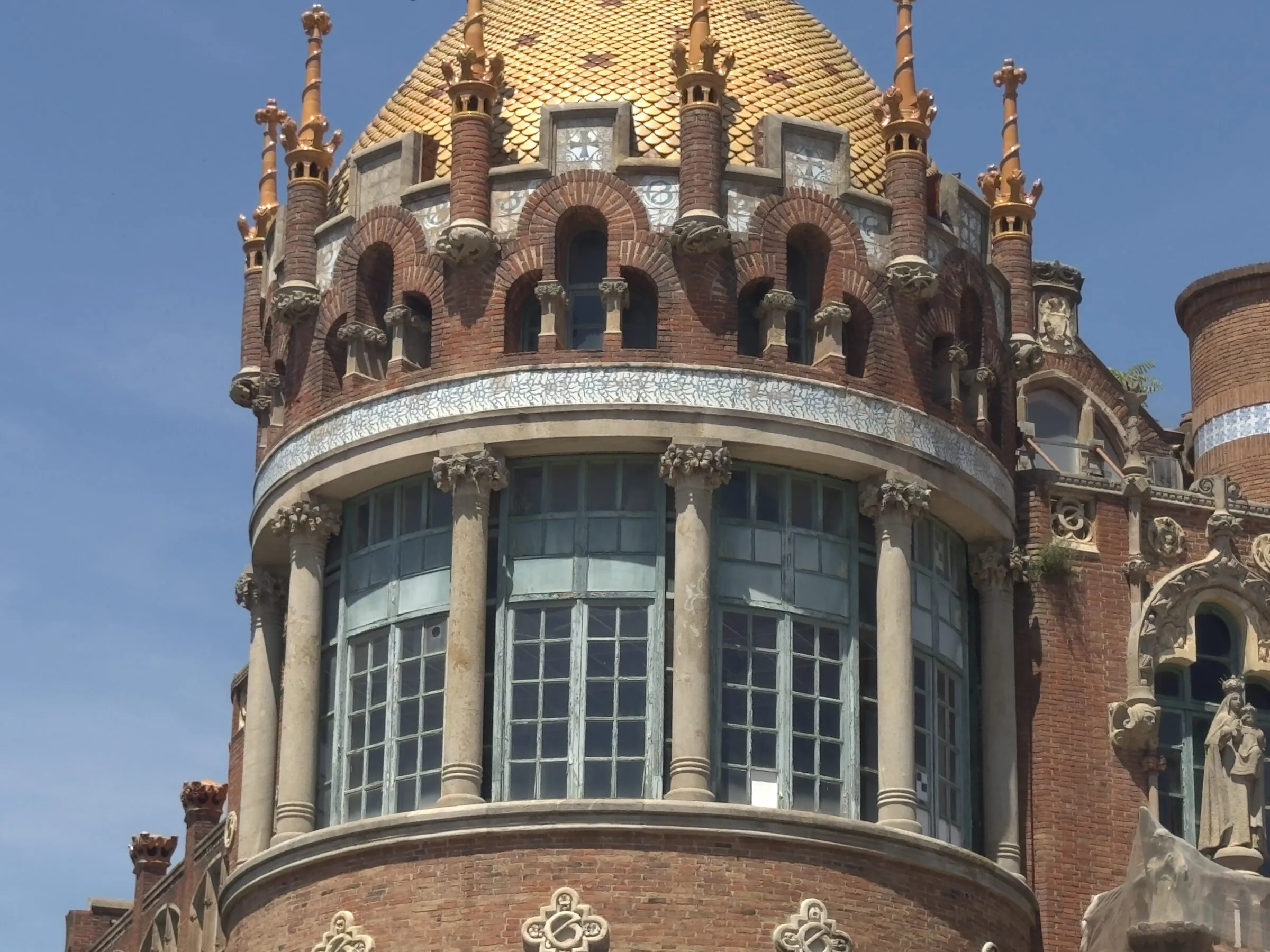 A mosaic tower and gold dome at the Hospital de Sant Pau, Barcelona