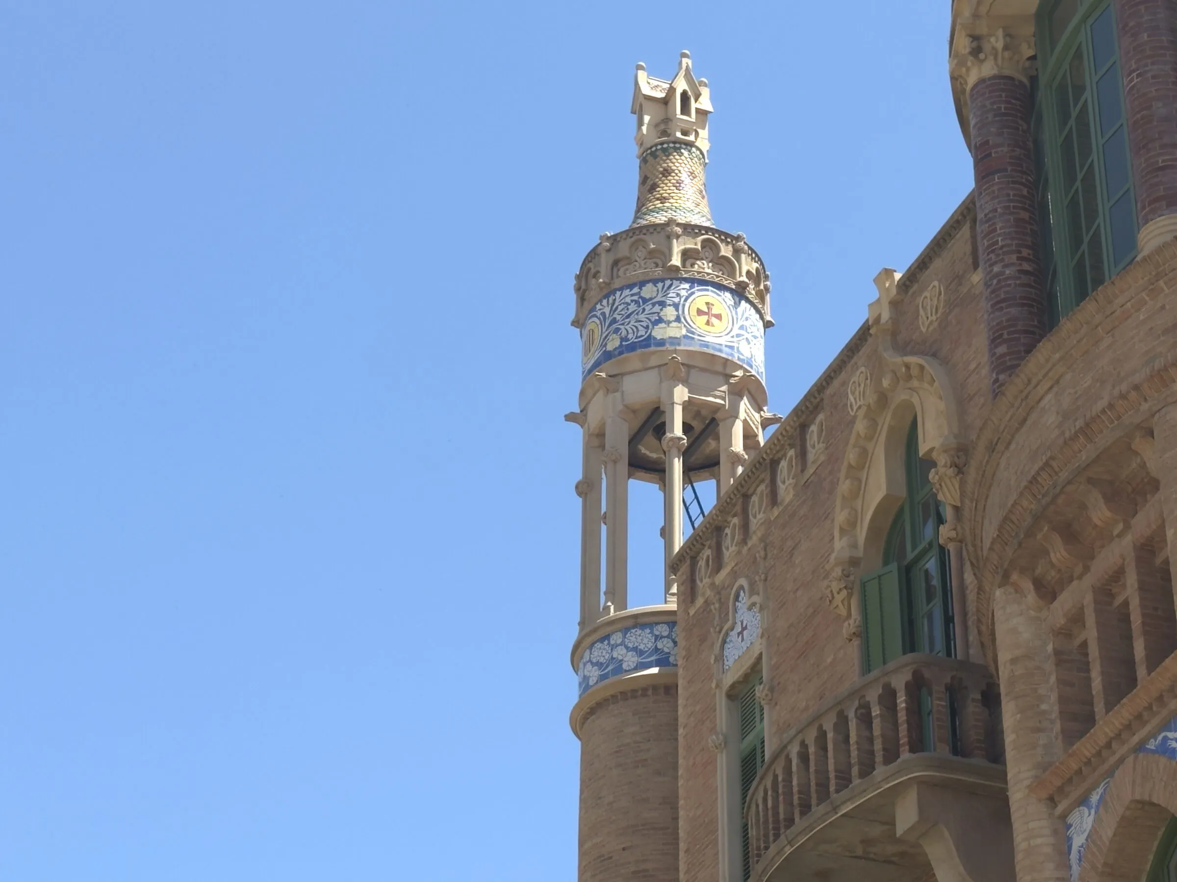 A mosaic tower and gold dome at the Hospital de Sant Pau, Barcelona