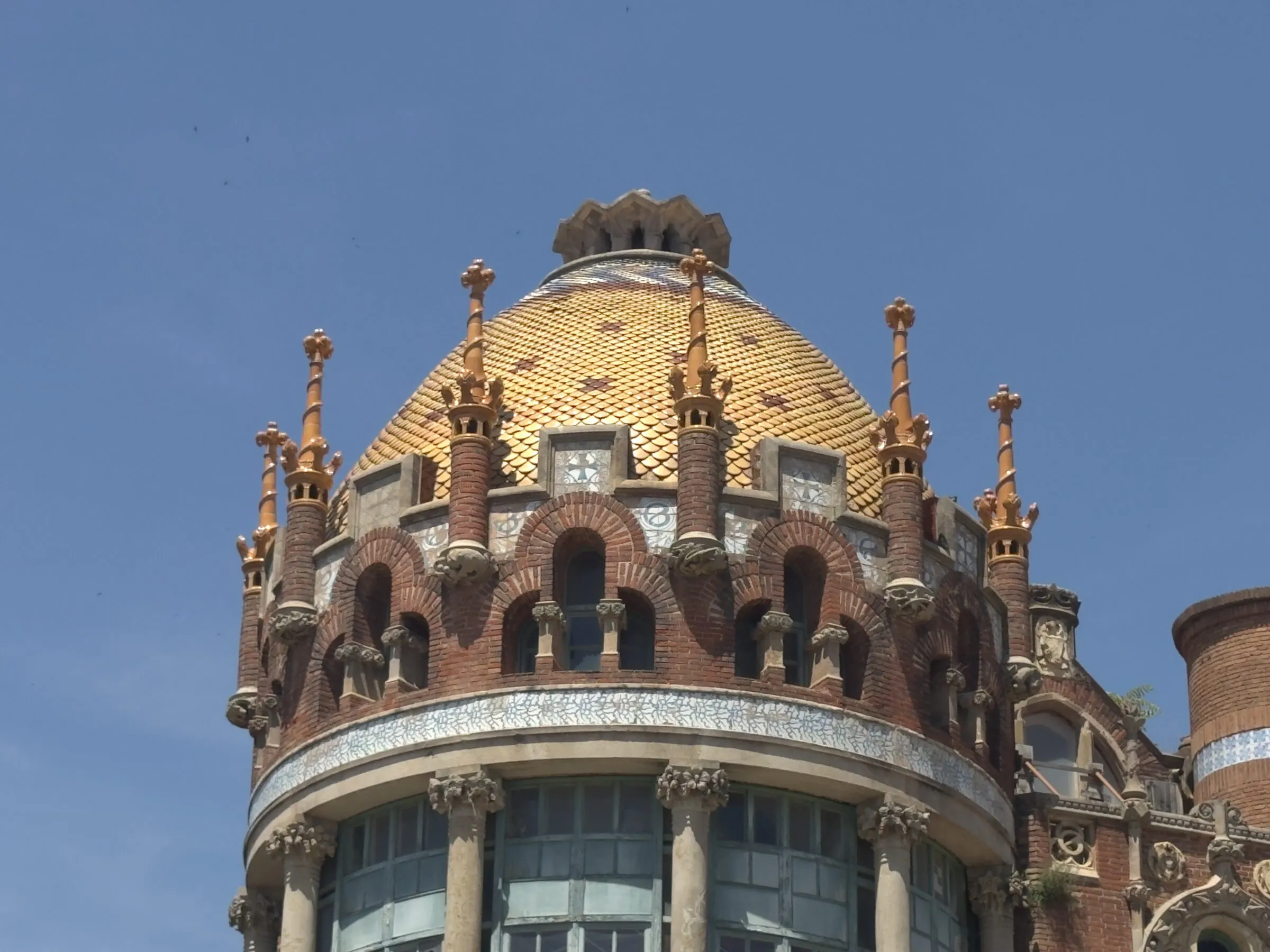 A mosaic tower and gold dome at the Hospital de Sant Pau, Barcelona